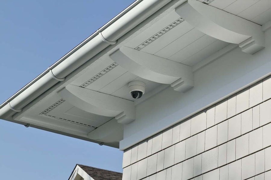 Domed security camera on the exterior corner of a residential property.