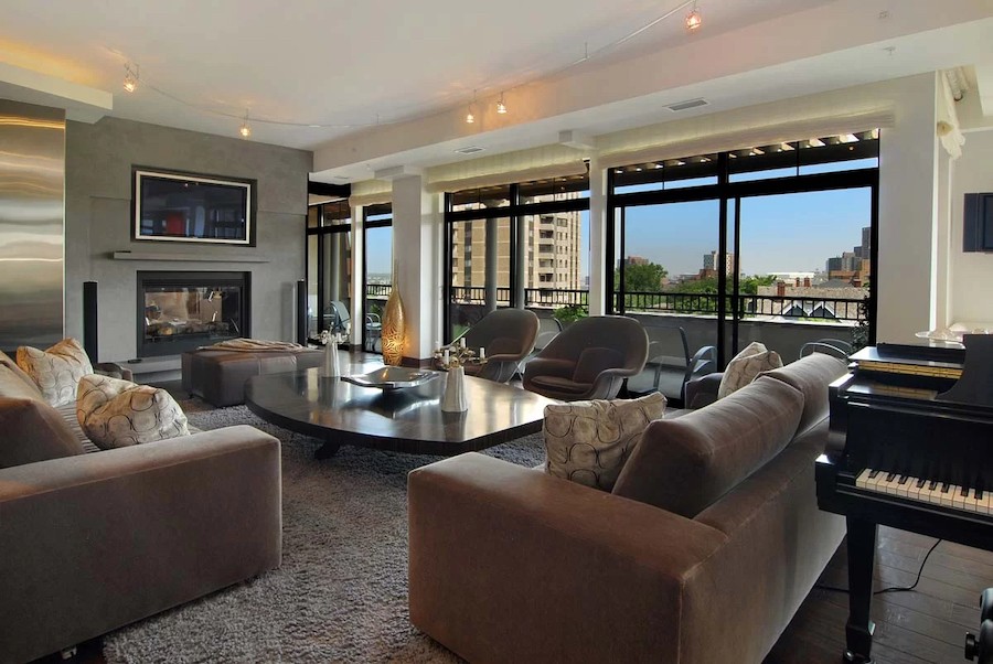 Sunroom in luxury house overlooking Lake Geneva, Wisconsin, with a TV and smart home automation control.