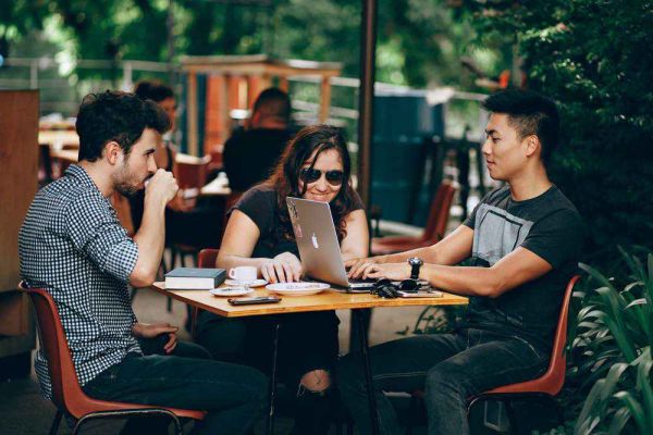 careers image, happy friends sitting at table