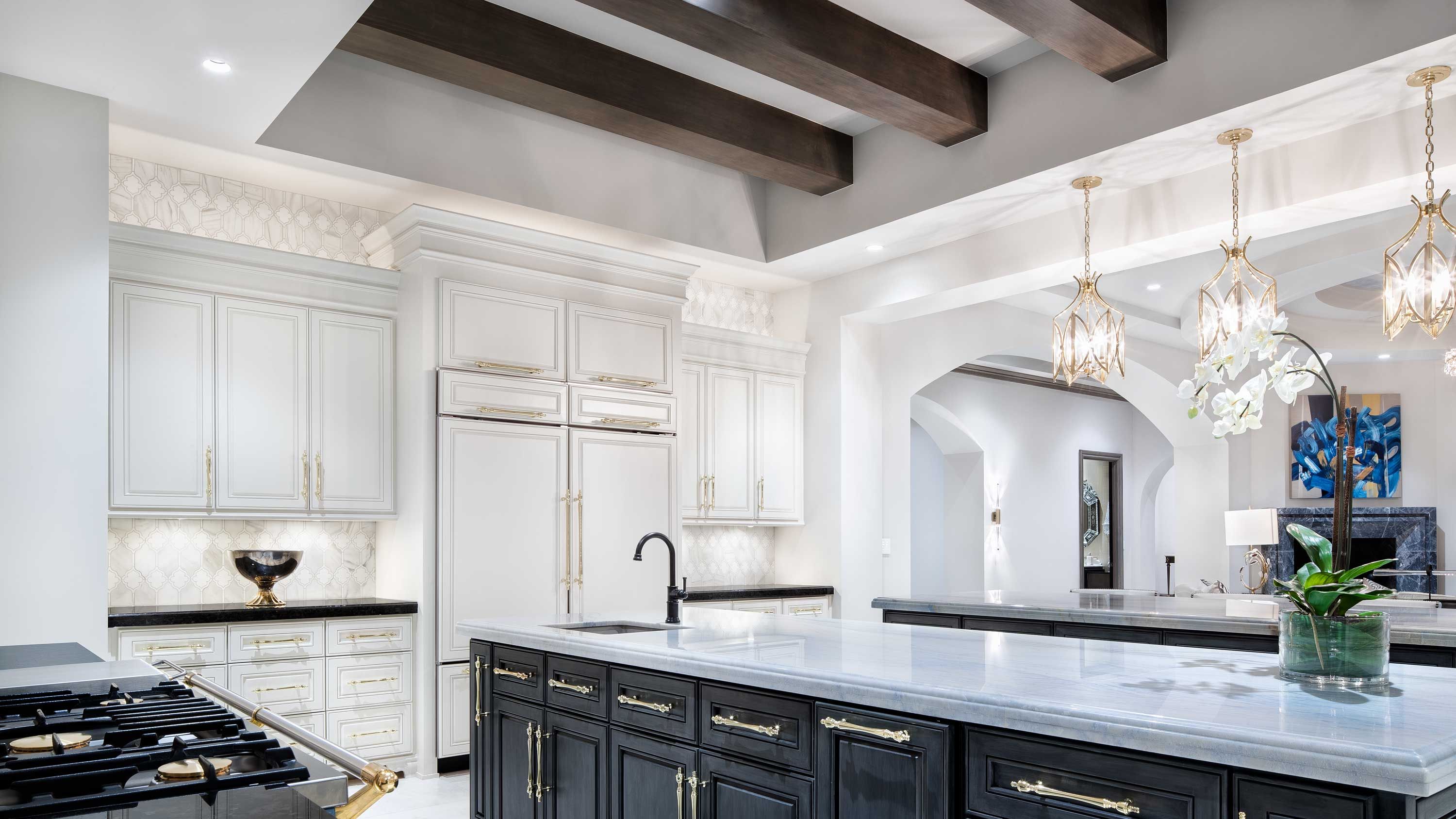 grey toned kitchen with modern cabinets and screen in the wall